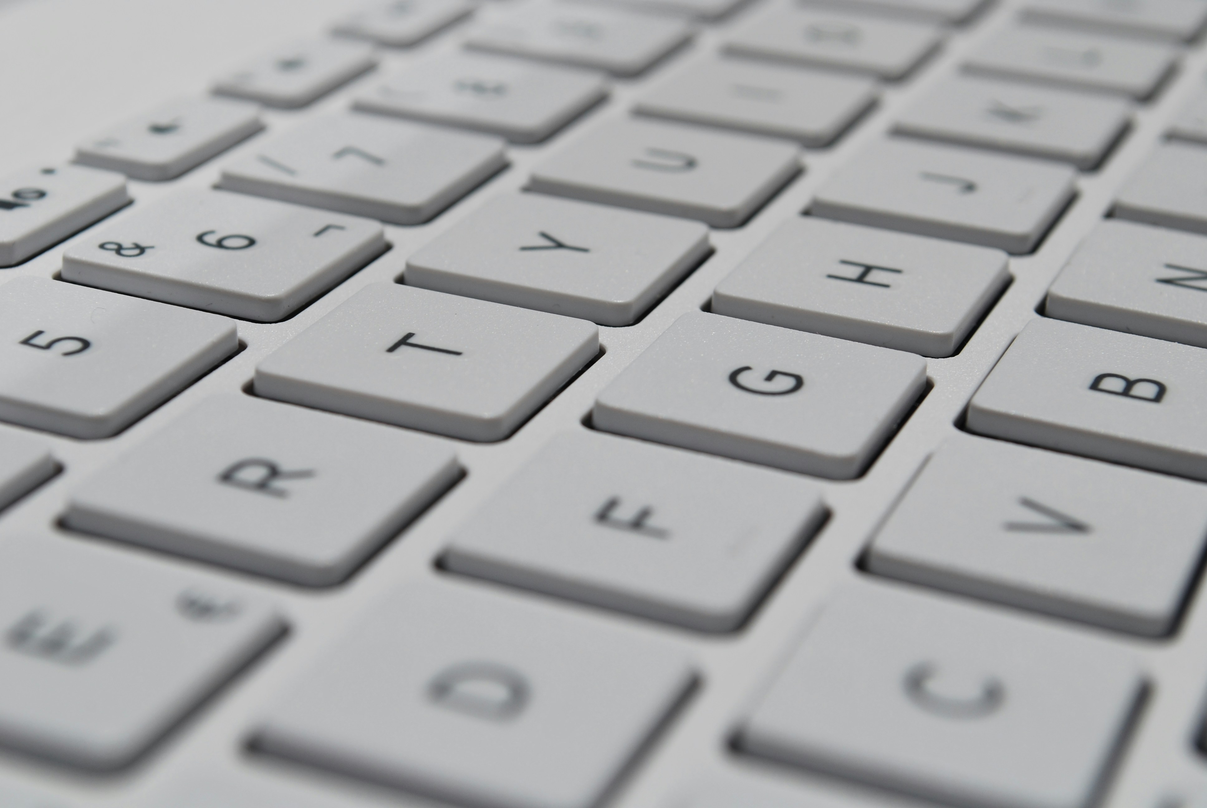 Close-up of a laptop keyboard and trackpad, illustrating build-quality considerations.